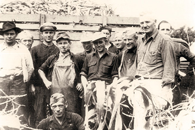 Small group of people posing for picture