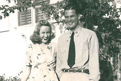 A man and woman smiling