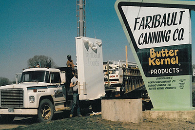 Truck next to Faribault sign