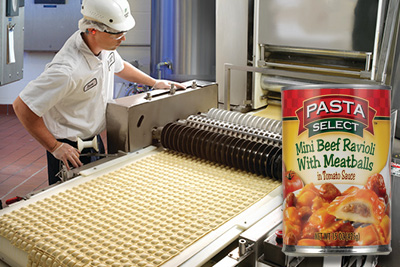 A can of food overlaying a man using a production machine
