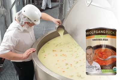 Can of food overalying a man scooping a cup of soup out of a vat