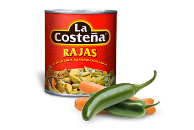 A pile of vegetables in front of a can of food